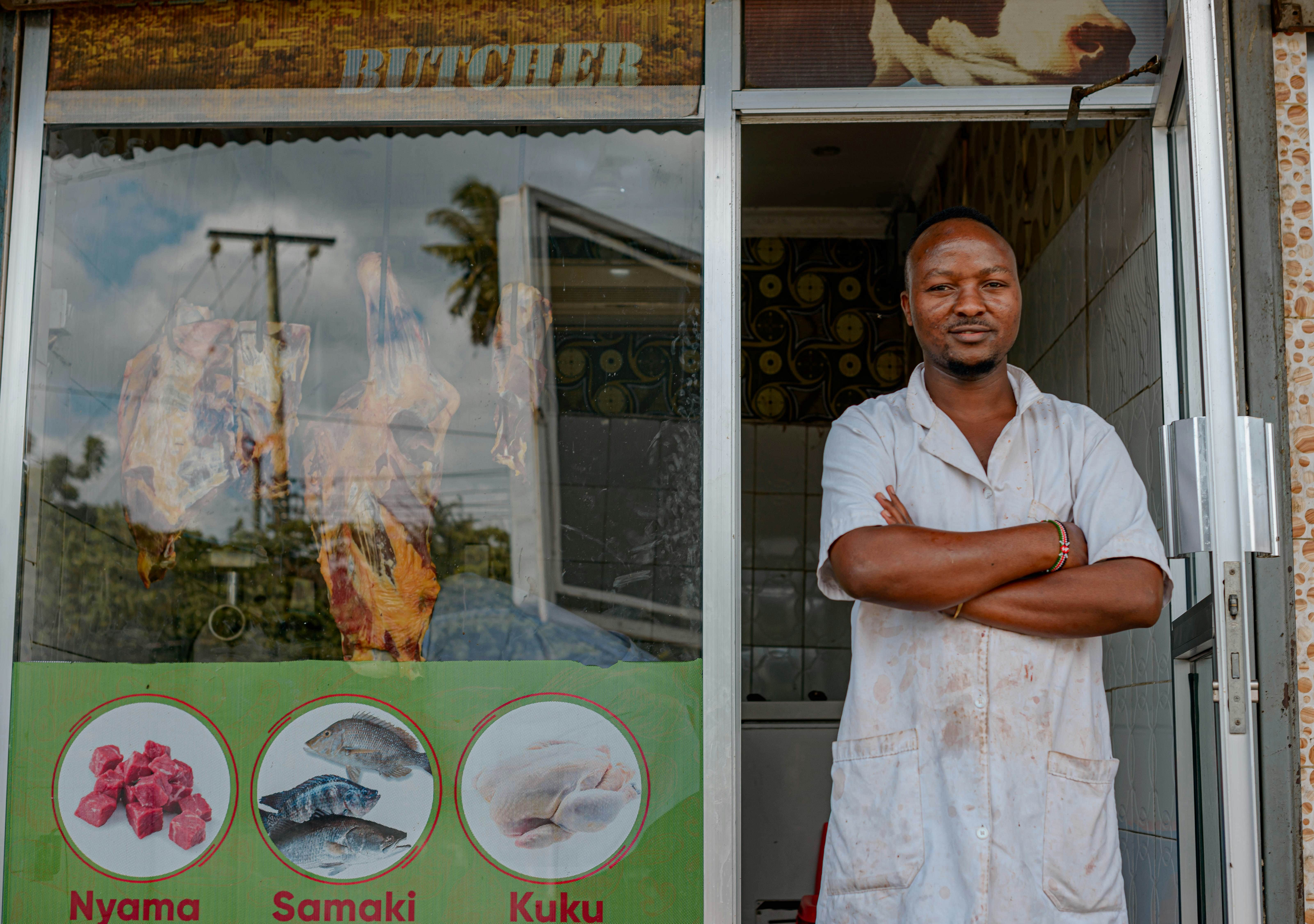 Halal butcher shop with fresh meat display, Islamic halal certification, clean modern interior